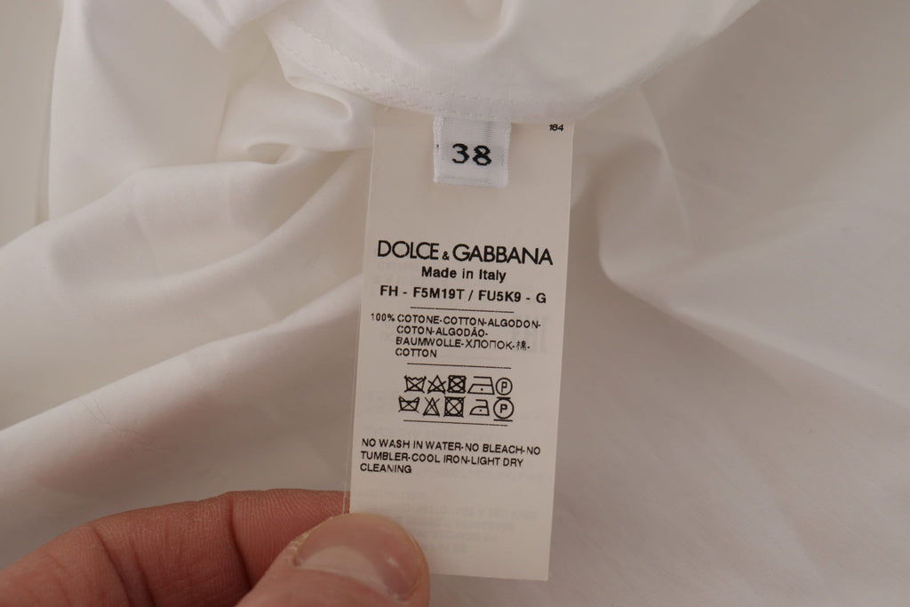 Dolce &amp; Gabbana Elegante ärmellose Smokingbluse mit Kristallknöpfen