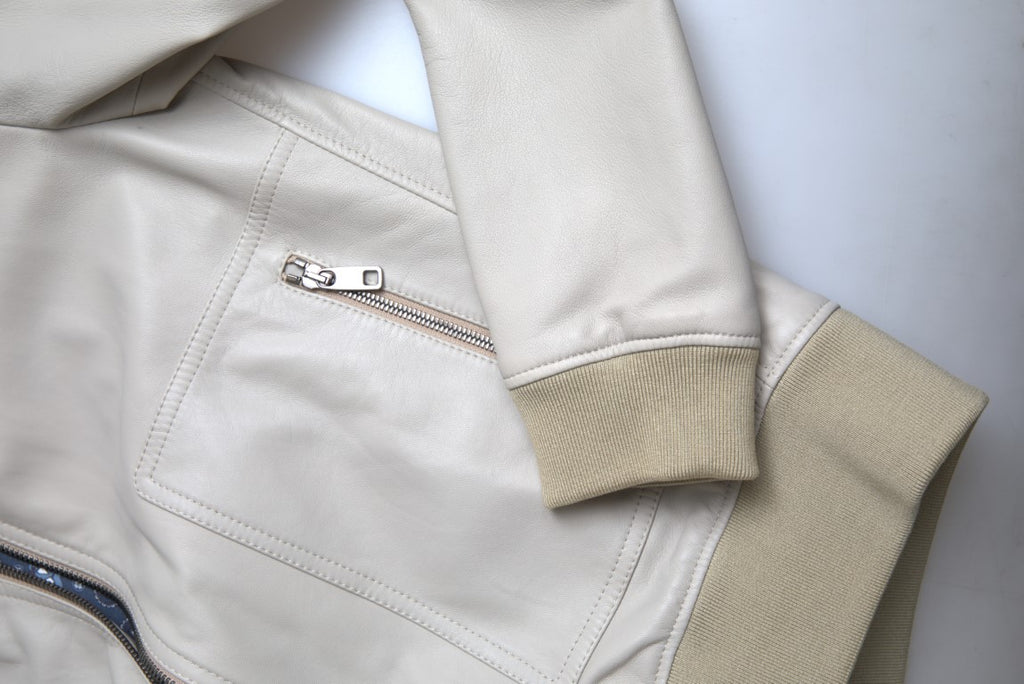Dolce &amp; Gabbana – Cremefarbene Bomber-Blousonjacke aus Leder mit durchgehendem Reißverschluss