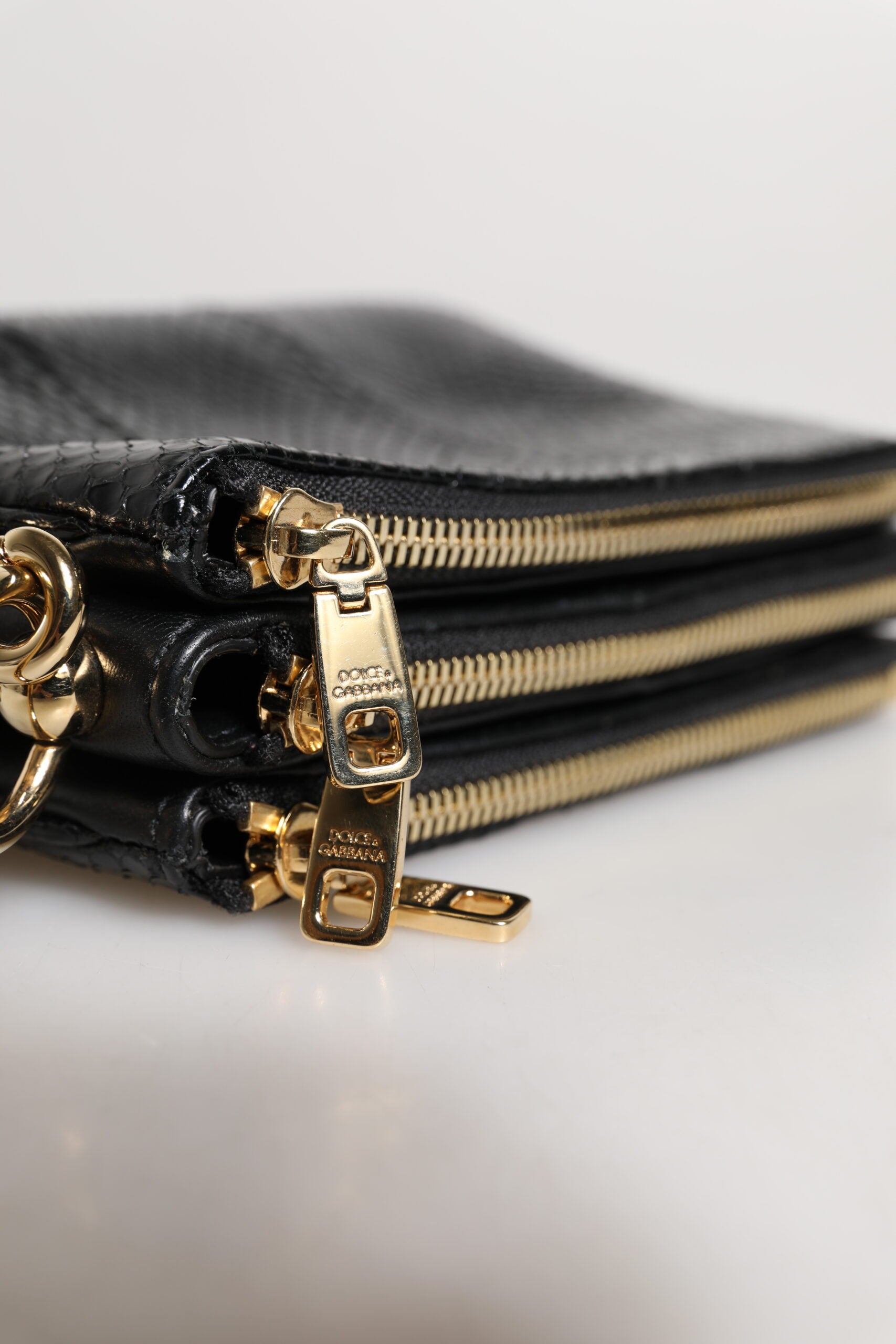 Dolce &amp; Gabbana – Schwarze Clutch aus exotischem Leder