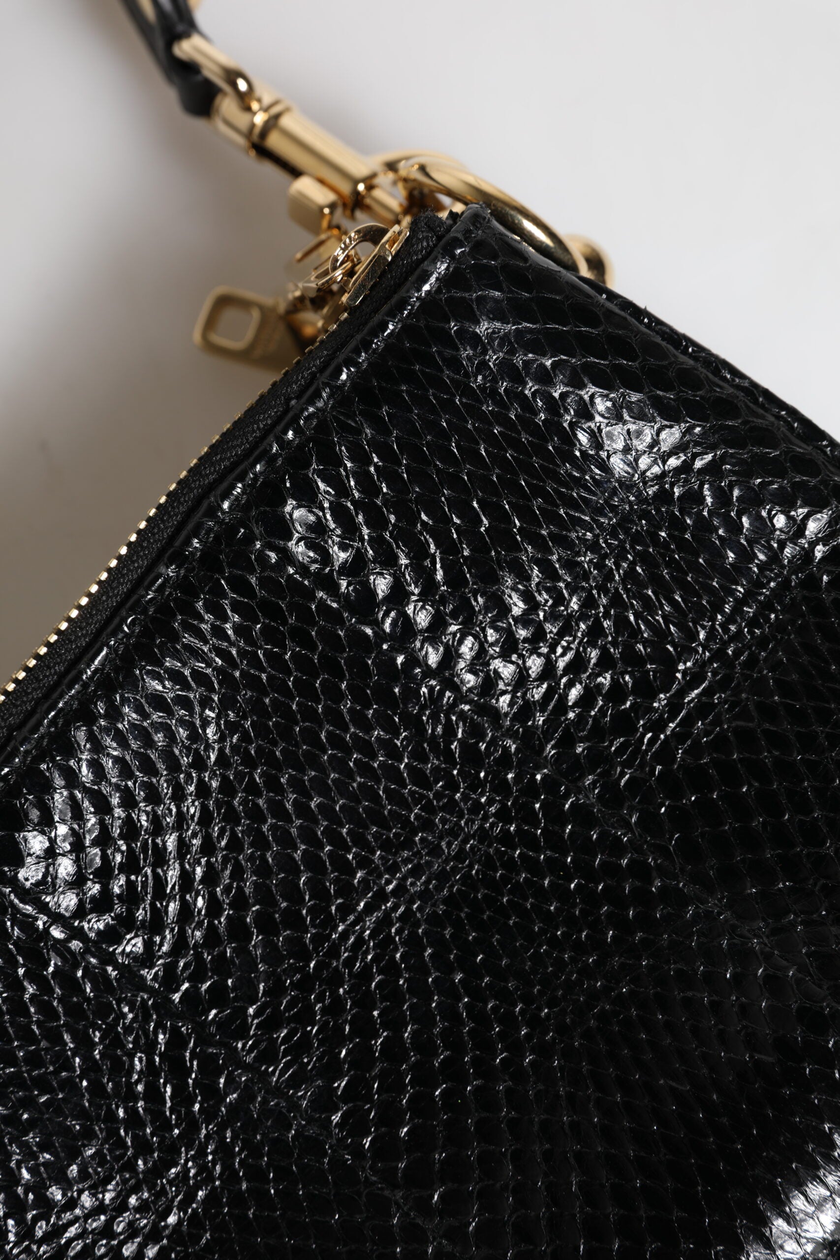 Dolce &amp; Gabbana – Schwarze Clutch aus exotischem Leder