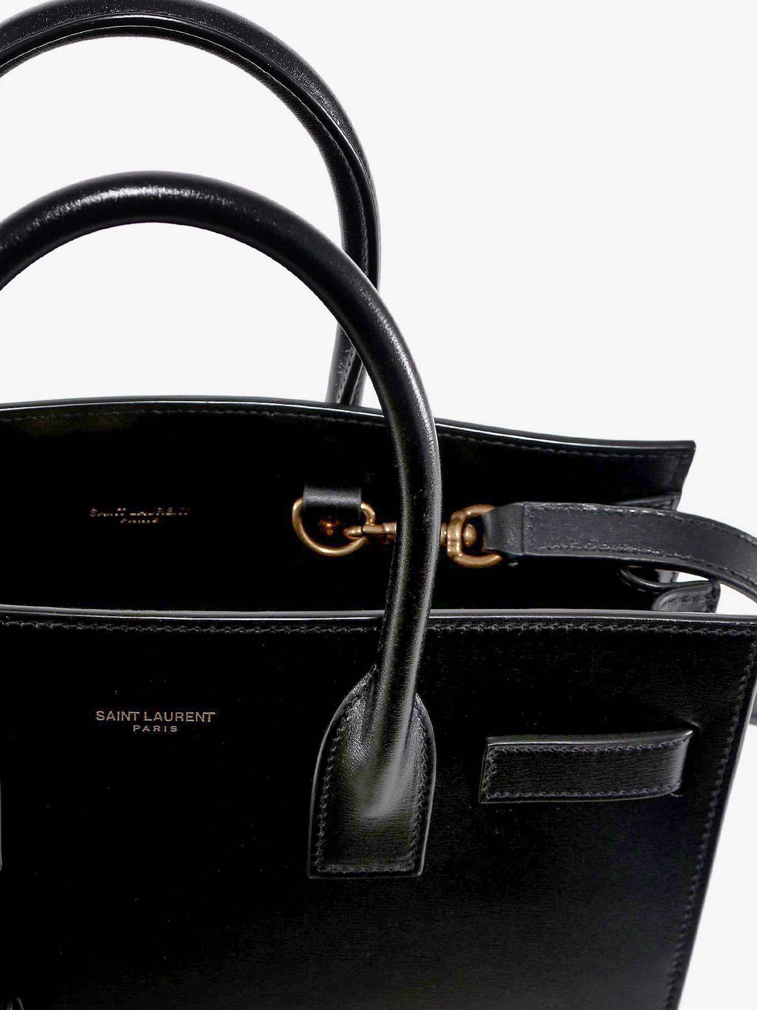 Saint Laurent Baby Sac de Jour leather handbag with padlock
