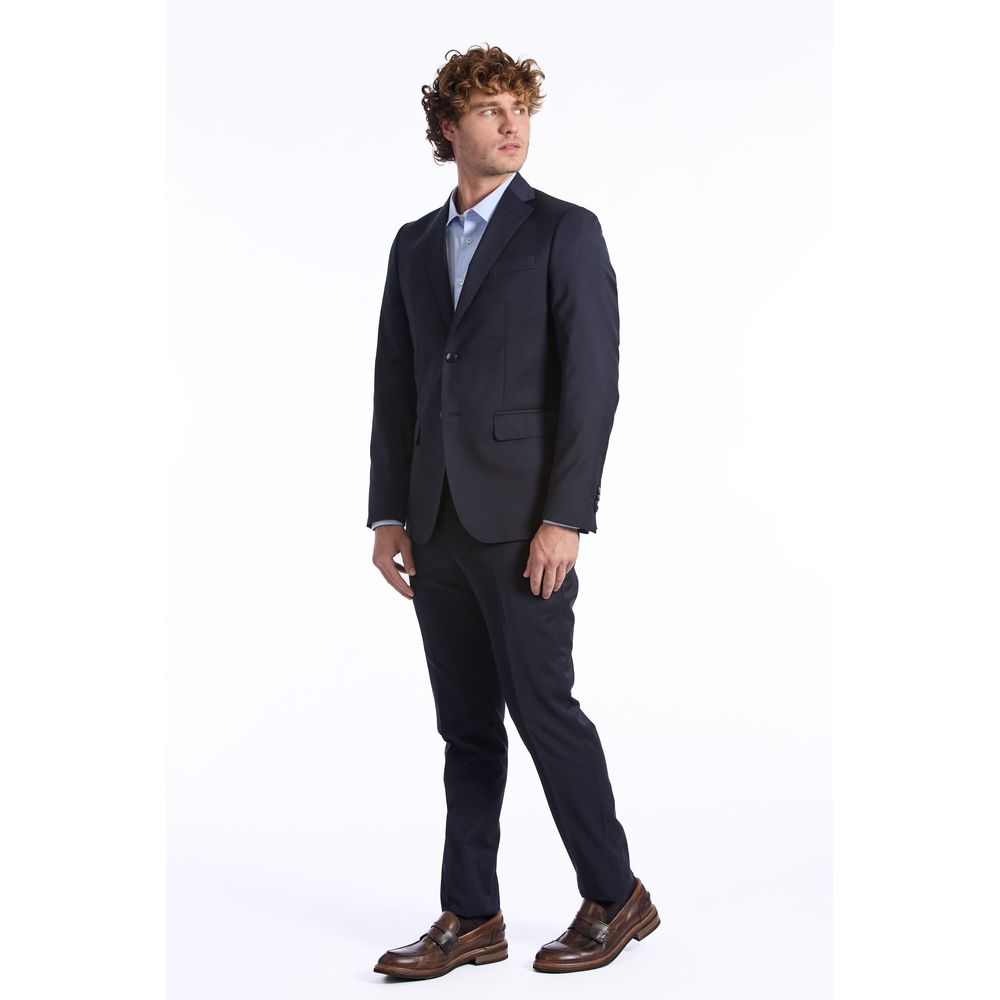 Man wearing a Baldinini blue wool suit paired with brown dress shoes and a light blue shirt