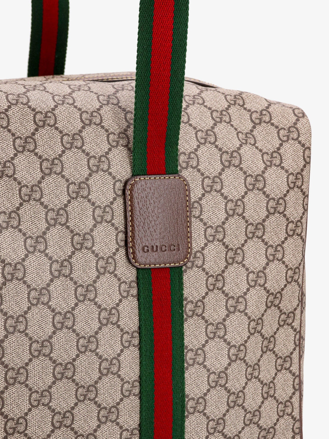 Gucci GG Supreme Fabric and leather travel bag with Web detail