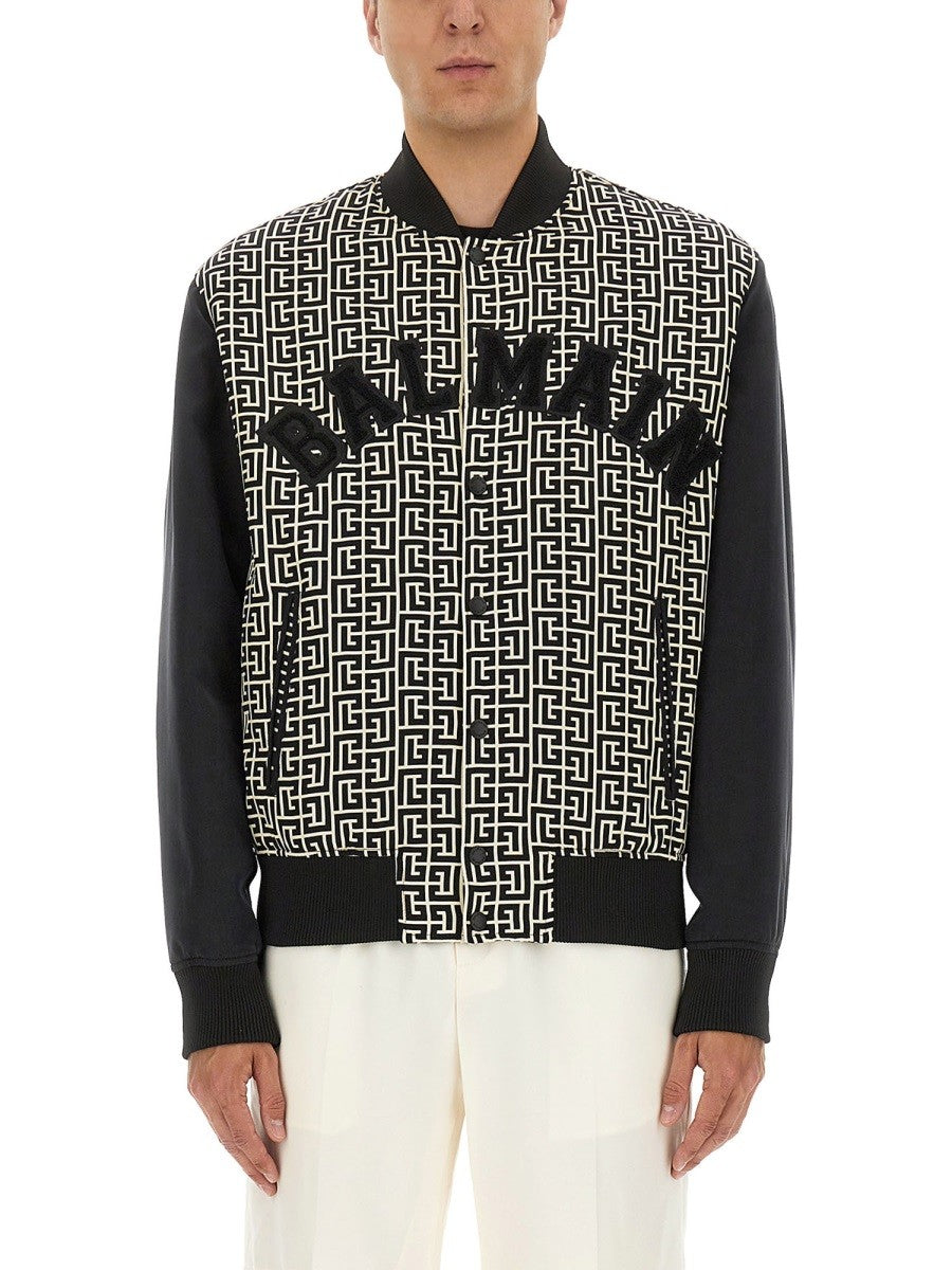 Balmain MONOGRAMMED VARSITY JACKET WITH PATCHES