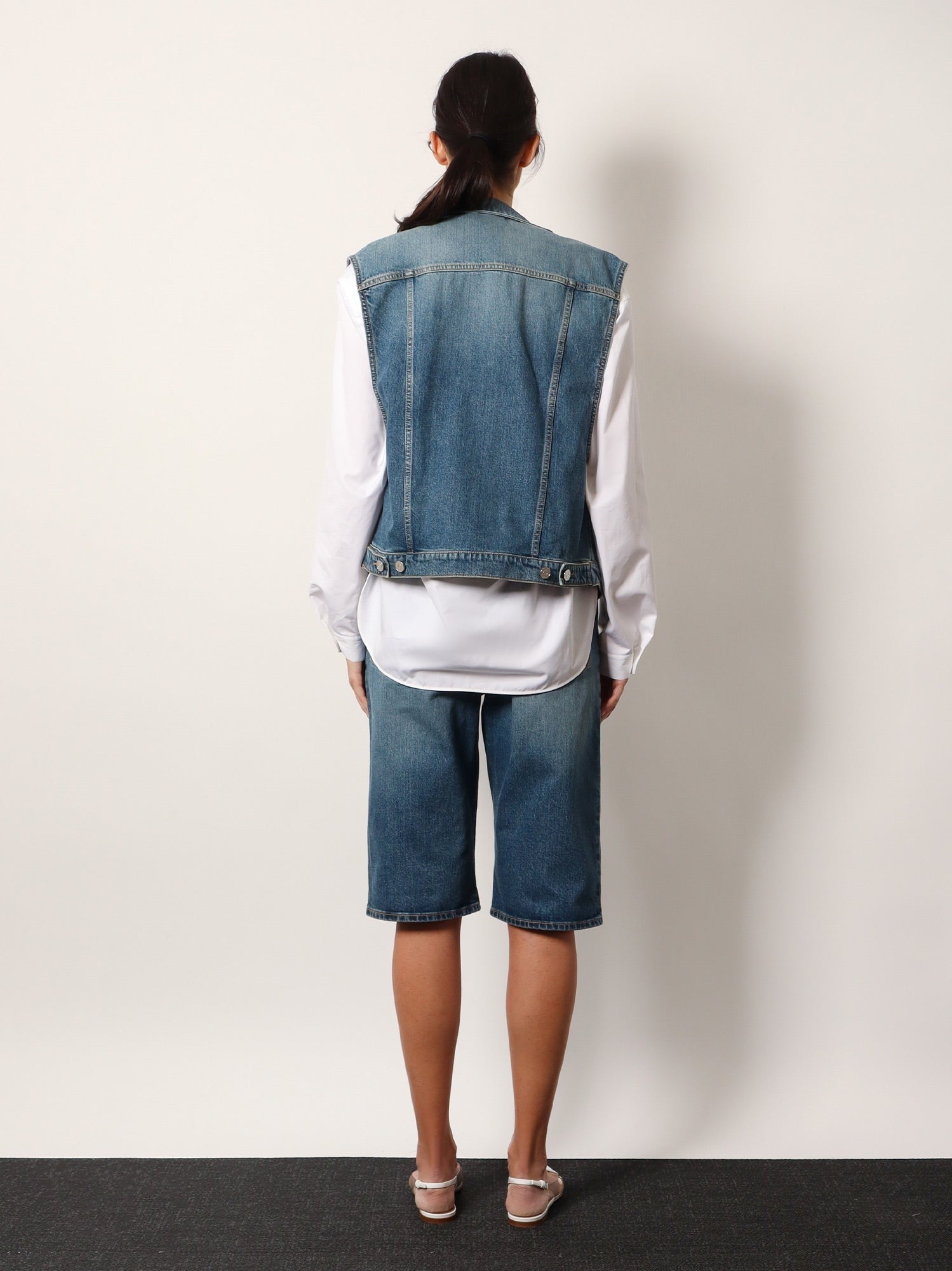 ALAIA Stone washed denim sleeveless jacket