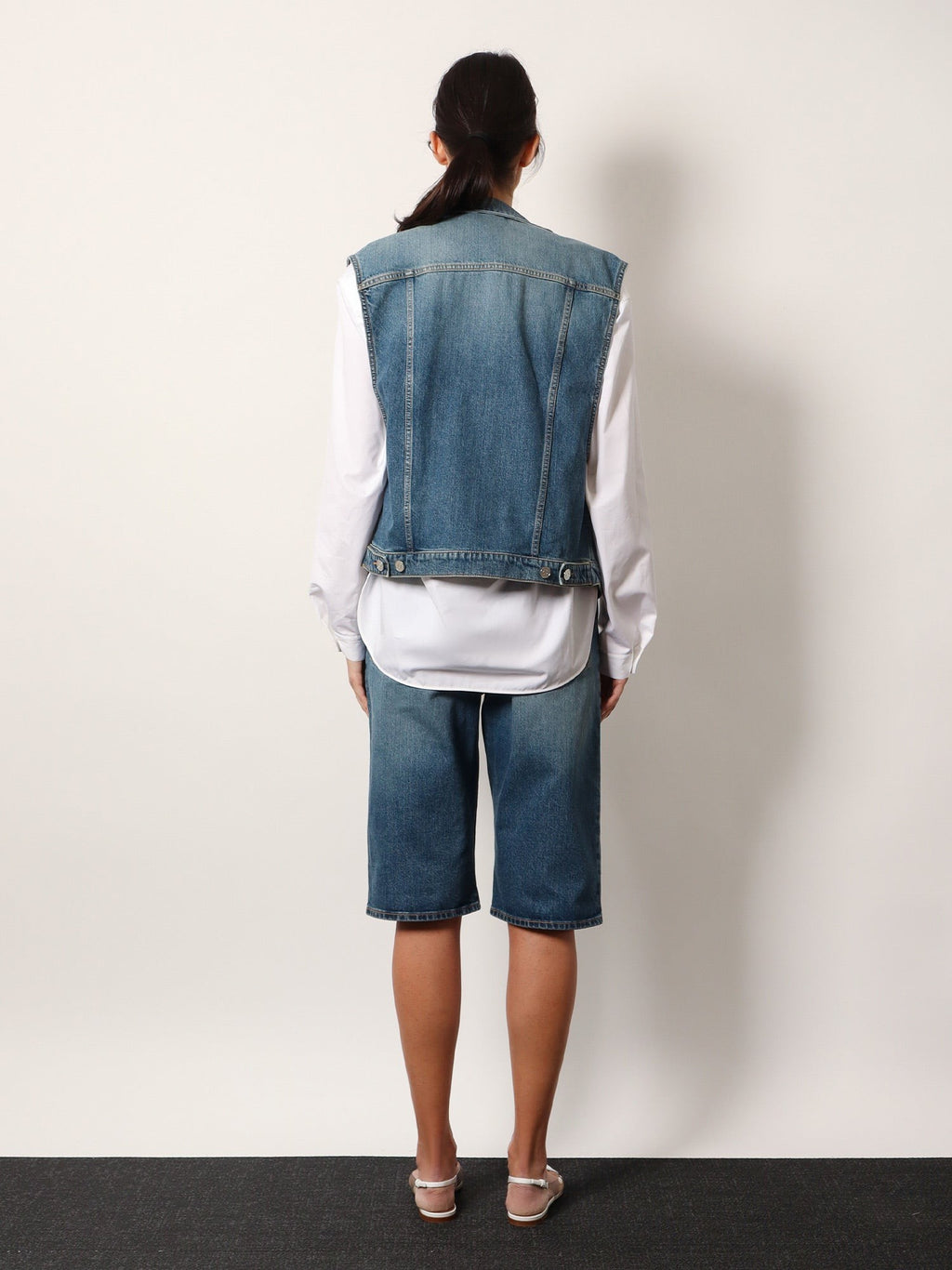 ALAIA Stone washed denim sleeveless jacket